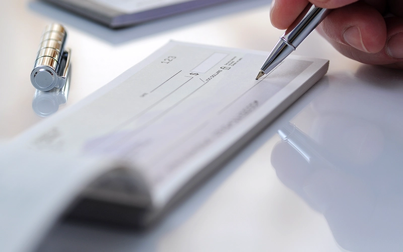 person writing check