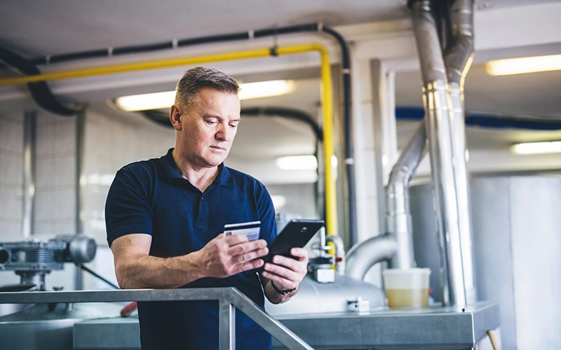 business man holding credit card