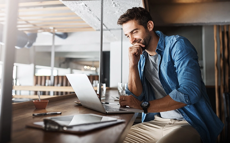 male business owner on laptop